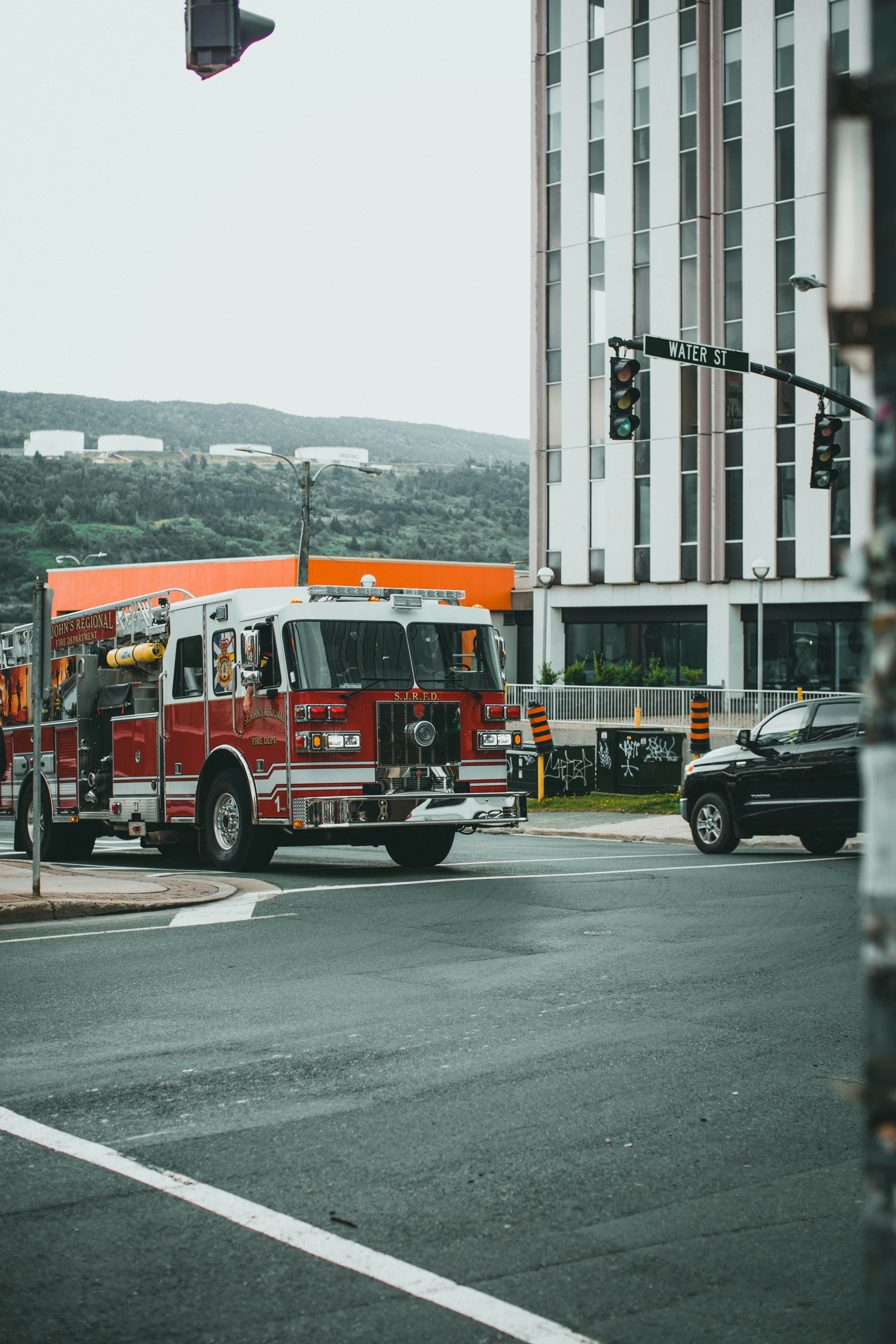 red and white fire truck on road during daytime